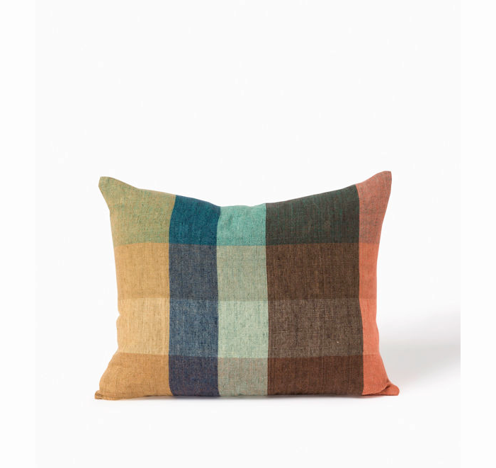 Checkered pillow with multicolor pattern on a white background