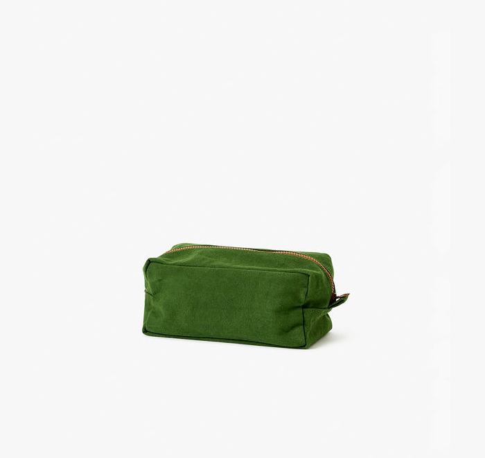 Green toiletry bag on a white background