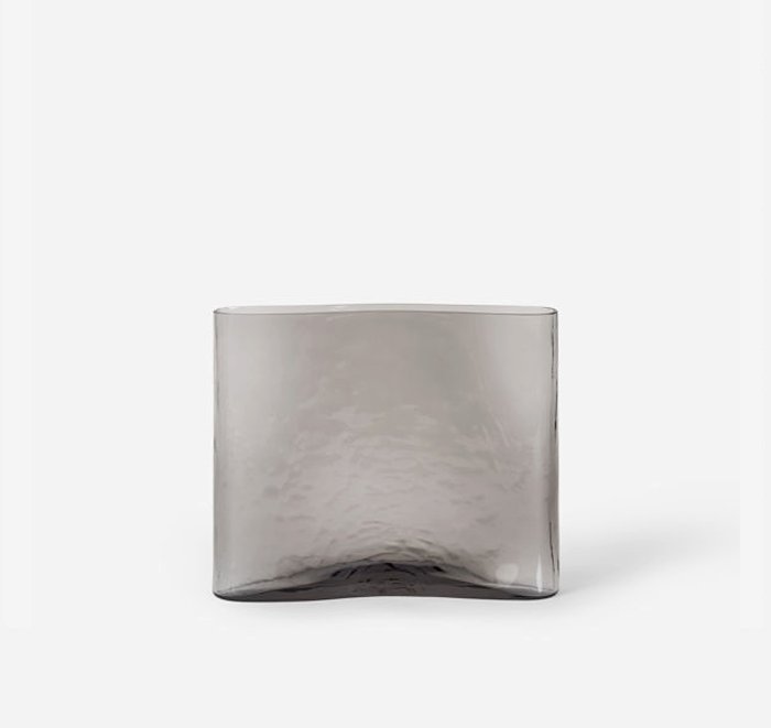 Smoky gray glass vase on a white background
