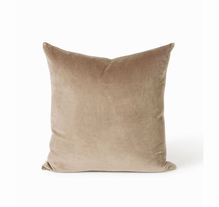 Beige pillow on a white background