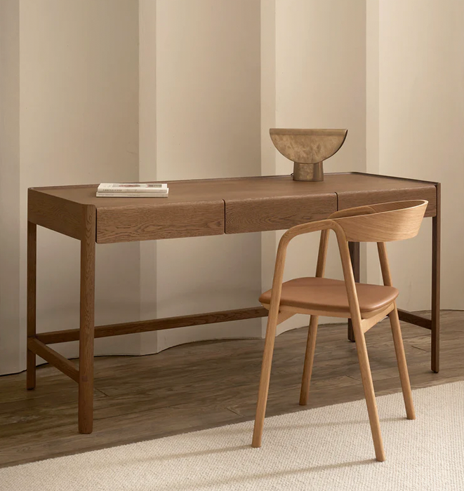 Wooden desk with a chair in a minimalistic room