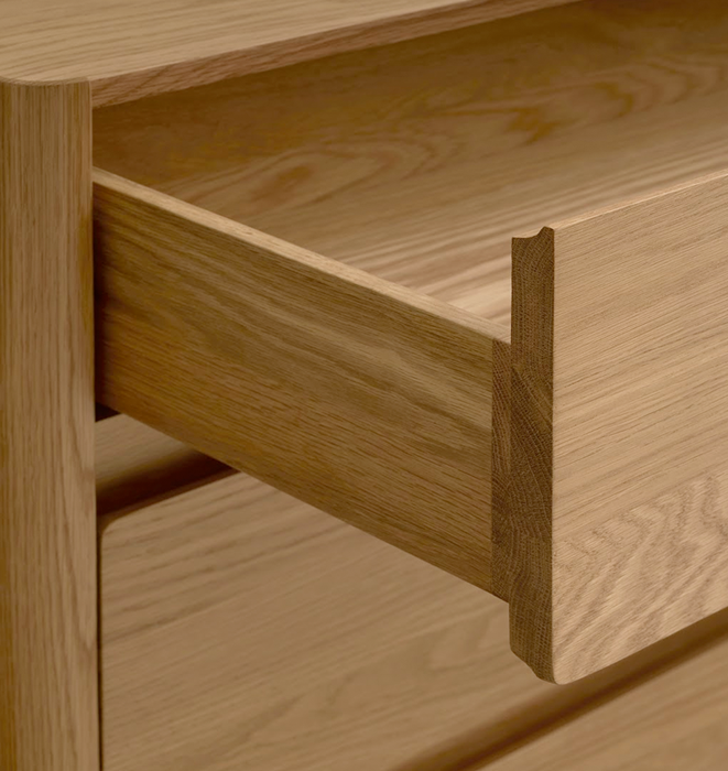 Close-up of a wooden drawer with a visible dovetail joint.