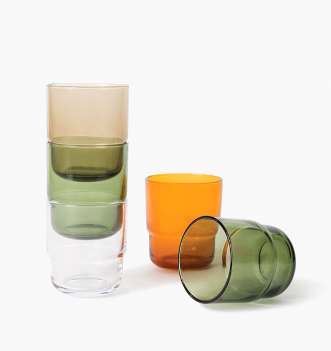 Set of colorful glass tumblers on a white background