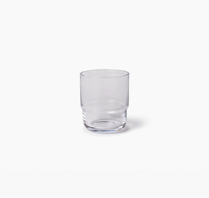Clear glass tumbler on a white background